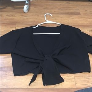 Cropped tie front top with ruffled sleeve details